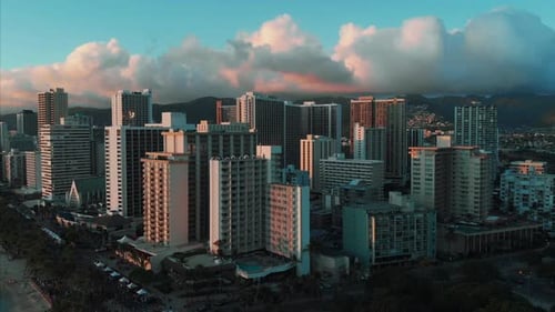 Aerial drone footage of Honolulu, Hawaii.
Beautiful real estate, buildings in the city.
Palm trees