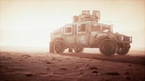 Military Patrol Car on Sunset in Desert Storm