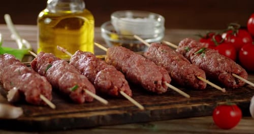 Homemade Raw Sausages on a Stick Slowly Rotate.