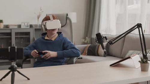 Teenage Child Playing Video Games with VR Headset