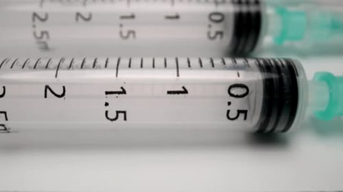 A Row of Medical Syringes
