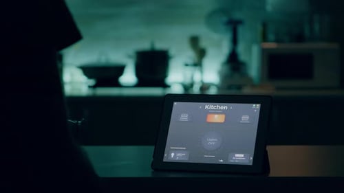 Hand Turning Lights On Using Smart Home App