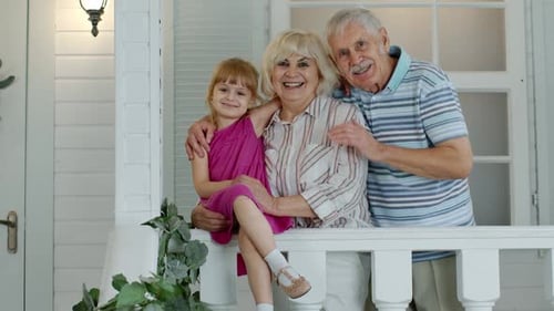 Girl With Grandparents on Porch of White House