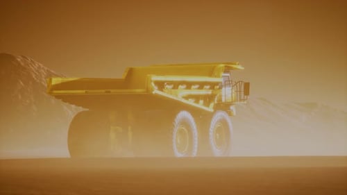 Large Yellow Mining Dump Truck Driving Through Dusty Desert
