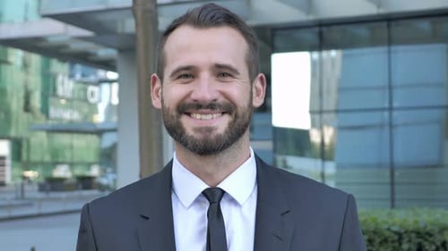 Smiling Young Adult Man in Suit and Tie