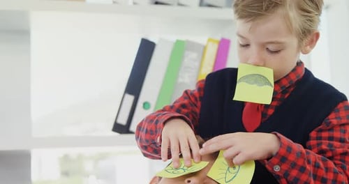 Two Children Playing with Sticky Notes Indoors
