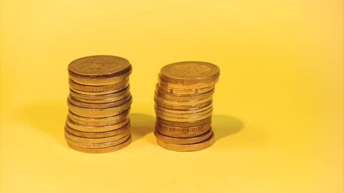 Stacks of Golden Coins Increasing