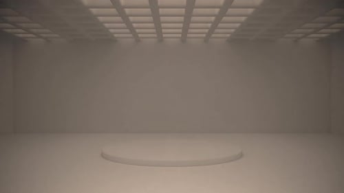 Les lumières se concentrent sur le podium central qui brille à travers les murs du plafond