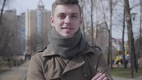 Young Adult Smiling in City Park