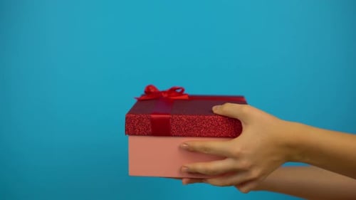 Hands Offer a Present, Then Refuse with Thumbs Down