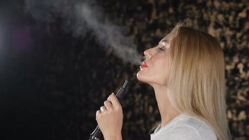 Blonde Woman Exhaling Smoke