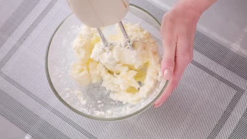 Mixing Ingredients with Electric Mixer in Bowl