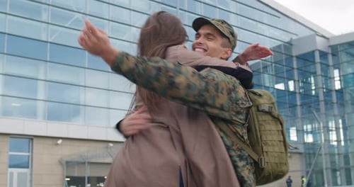 Soldier's Joyful Reunion with Woman at Airport