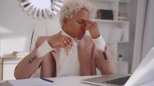 Exhausted African American Woman Massaging Nose Bridge Suffering From Dry Eyes