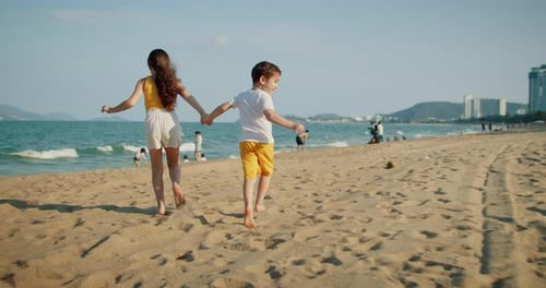 Children Run on Beach