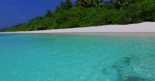 Natural drone island view of a white sandy paradise beach and turquoise sea background in colourful
