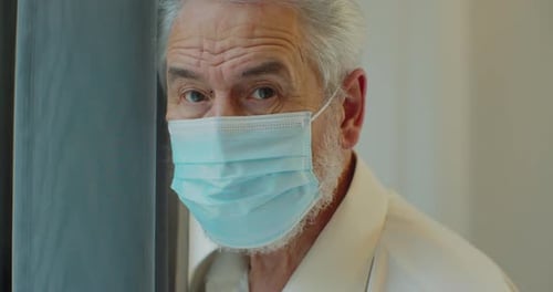 Senior Man in Surgical Mask Looking Ahead