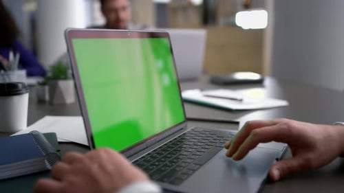 Entrepreneur Man Searching Laptop Green Screen on Diverse Business Team Meeting