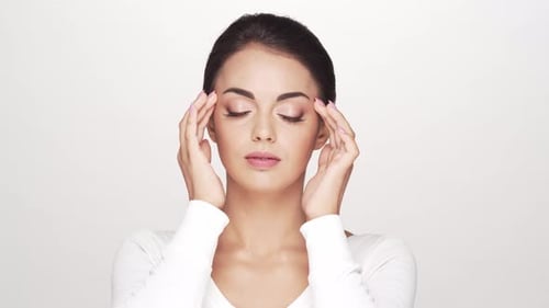 Studio portrait of young and beautiful brunette woman over