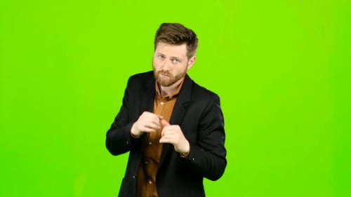 Man Is Standing in a Rack and Boxing. Green Screen