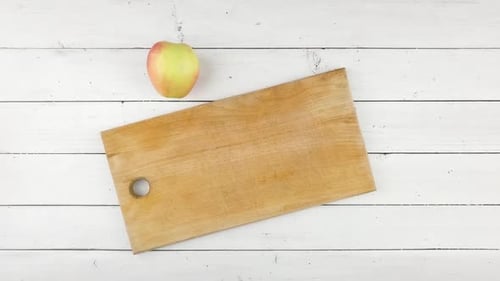 Apple Slicing Overhead on Wooden Cutting Board