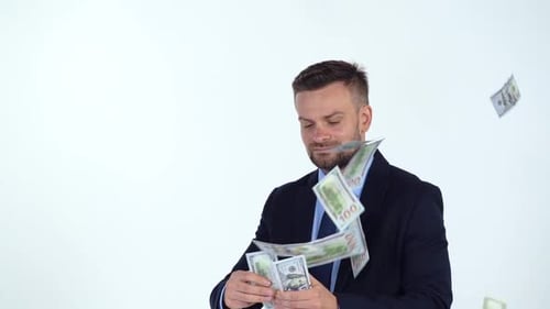 Man in Suit Throws Money in the Air