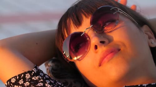 Happy Woman Resting at Sunset