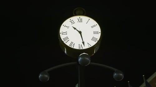 A street clock, at night