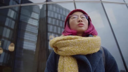 Stylish Woman Takes Photo of City Buildings