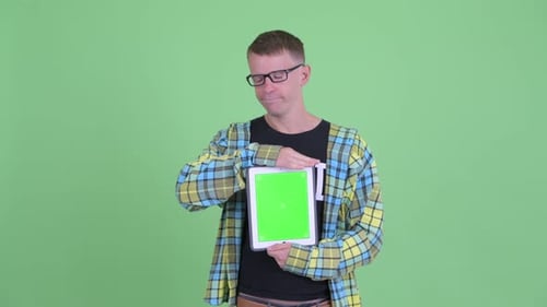 Young Adult Holding Tablet with Green Screen