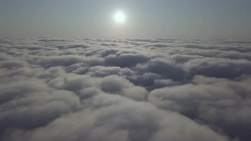View From a Drone on a Sea of Clouds to the Horizon at Dawn