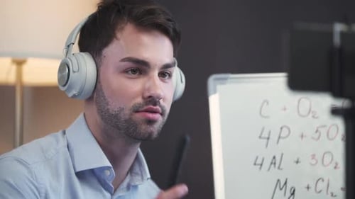 Man Wearing Headphones on a Video Call