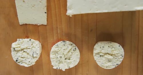 Cheese Slices on Wooden Cutting Board Overhead