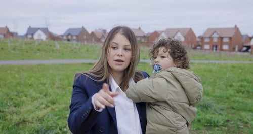 Portrait shot of mother and son together at park