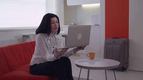 Woman Talking During Video Conference on Laptop