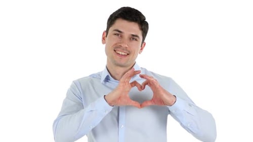 Young Adult Makes Heart Shape With Hands