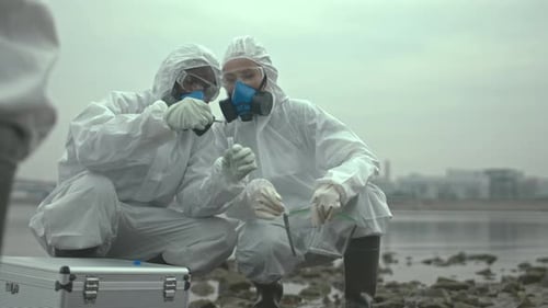 Scientists Taking Soil Sample in Biohazard Area