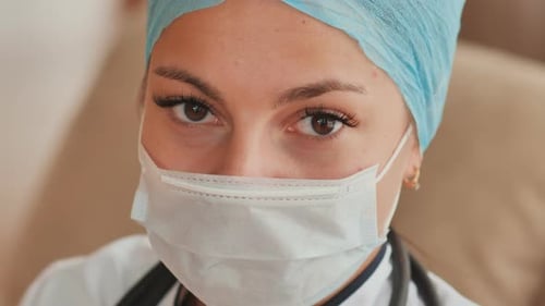 Medical Professional Wearing Face Mask and Surgical Cap