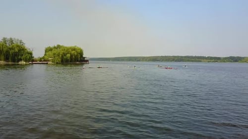 Young Children Kayaking On River. People in boat rowing in kayak over the river