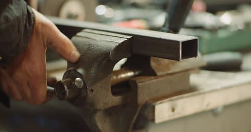 Man Working at Metal Industry - Cutting and Measuring Metal Parts at Workshop