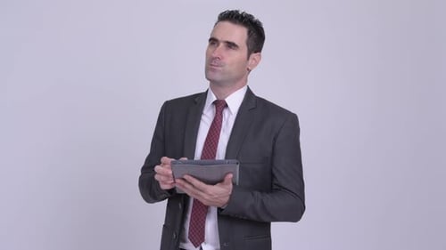 Businessman Using Tablet Device for Smart Solutions