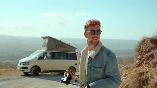 Man and Camper Van Explore Rural Landscape
