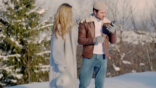 Affectionate Couple Taking Selfie in Winter Wonderland
