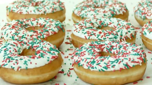 Donuts with White Icing and Red and Green Sprinkles