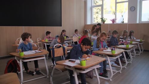 Diverse Children During Drawing Lesson at School