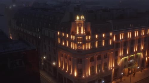 Pull Back Footage of Illuminated Historic Building of Luxurious Hotel