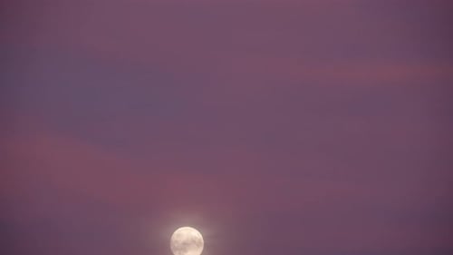 Moon Rising in a Darkening Night Sky