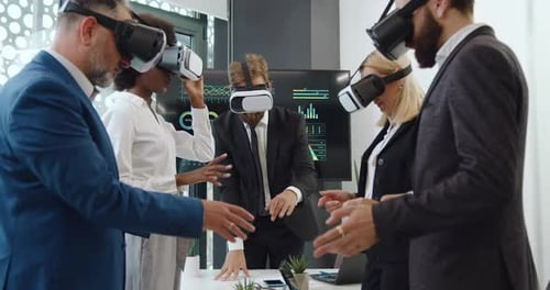 Business Team Using VR Headsets in Office