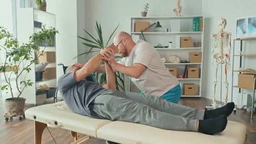 A Man With a Brain Stroke Undergoes a Health Recovery Therapy Session