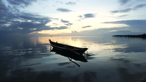 Wooden Boat At Sunset